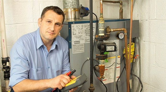 technician near a heater
