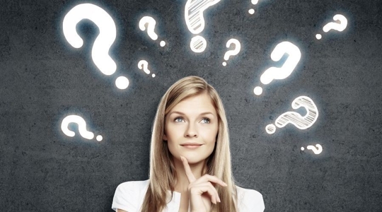 woman with question marks around her head